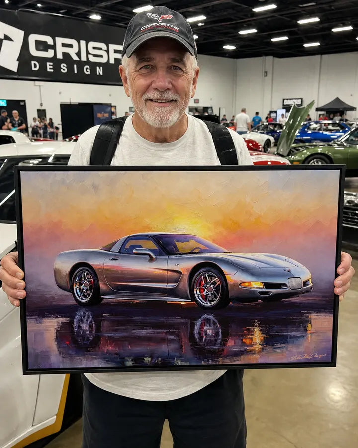 Customer holding his framed Corvette artwork