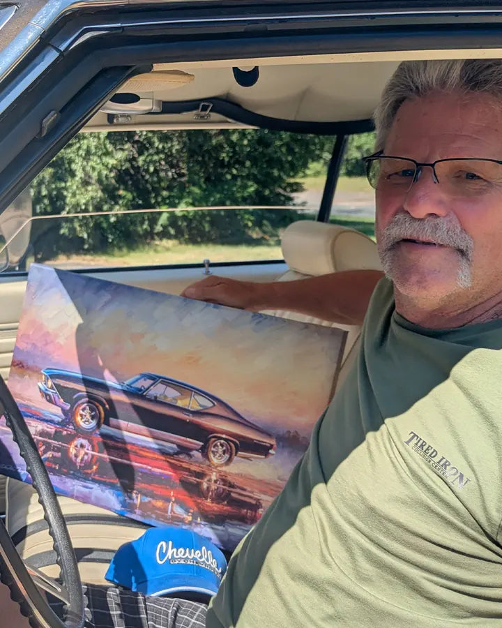 Mike in his Chevelle with the canvas of it