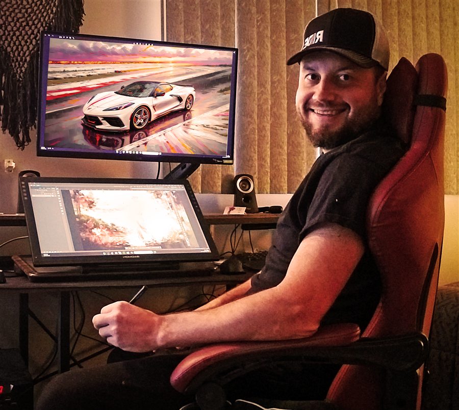 Wes Klee at his desk, painting a Corvette