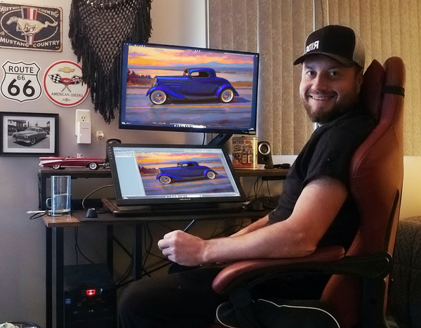 Customer holding a framed painting of her car, matching canvas on the wall behind her